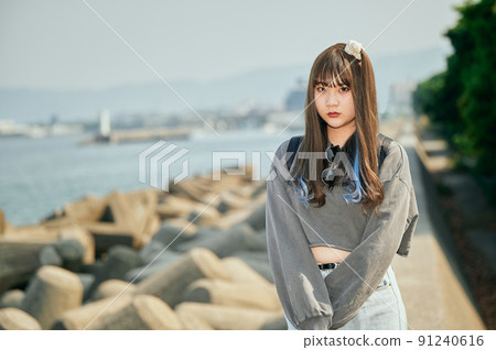 Gen Z women standing looking at the camera Gen Z women standing looking at the camera 91240616