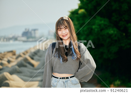 Gen Z women standing looking at the camera 91240621