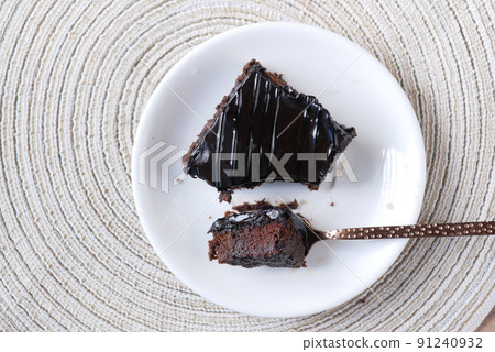 slice of brownie on plate on table  91240932