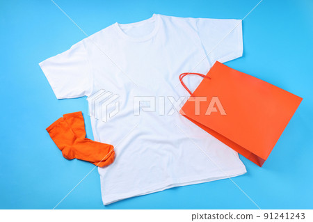 Blank t-shirt, bag and socks on blue background 91241243