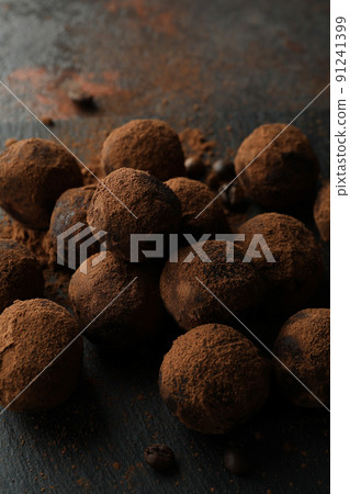 Concept of sweets with truffles on dark textured background Concept of sweets with truffles on dark textured background 91241399