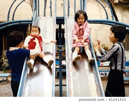 1975's Good friends playing on the slide 1975's Good friends playing on the slide 91241432