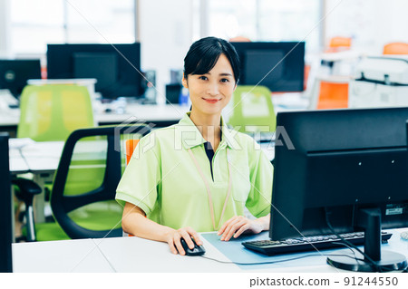 A young woman doing a long-term care office job in the office A young woman doing a long-term care office job in the office 91244550