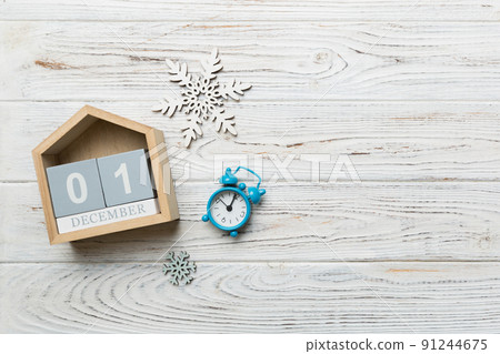 Christmas wood calendar with new year decorations, aganist colored background. Christmas calendar 1 december Christmas wood calendar with new year decorations, aganist colored background. Christmas calendar 1 december 91244675