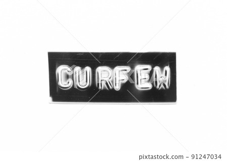 Black color banner that have embossed letter with word curfew on white paper background 91247034