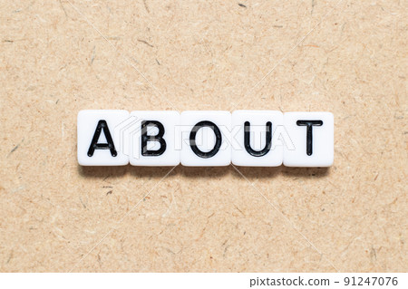 White tile alphabet letter with word about on wood background 91247076