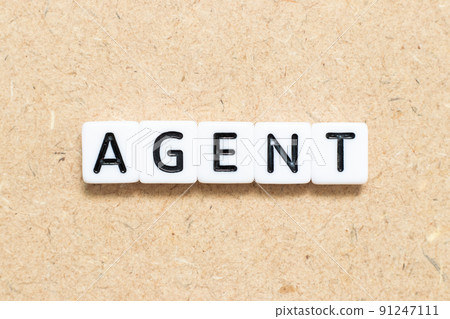 White tile alphabet letter with word agent on wood background White tile alphabet letter with word agent on wood background 91247111