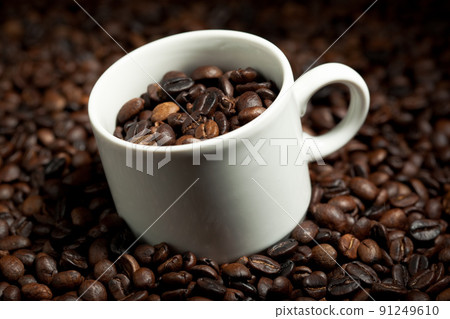 cup with coffee beans cup with coffee beans 91249610