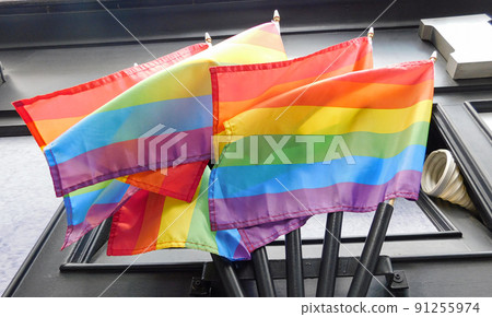 Pride rainbow lgbt gay flag being waved on wall background 91255974
