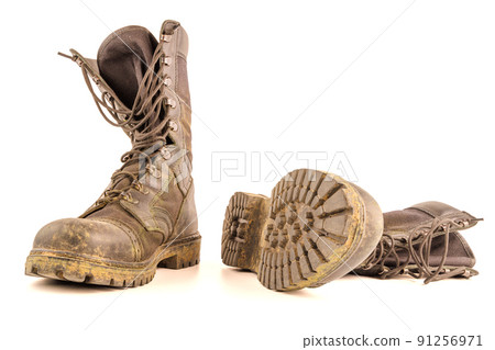 dirty military style light ankle boots isolated on white background dirty military style light ankle boots isolated on white background 91256971