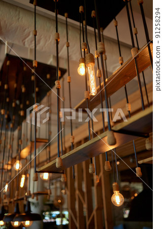 Close up many yellow lamp in cafe at night. Close up many yellow lamp in cafe at night. 91258294