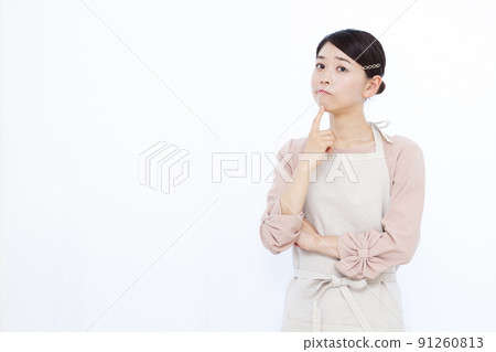 Housewife in her thirties who is seriously worried Housewife in her thirties who is seriously worried 91260813