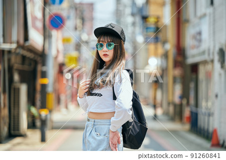 Gen Z women standing looking at the camera 91260841
