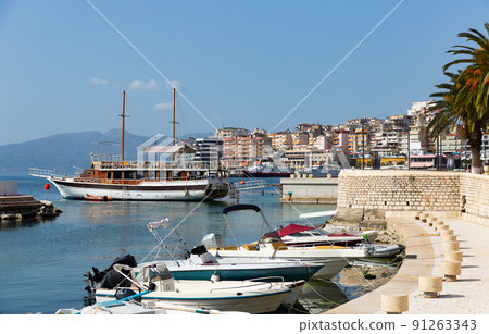 Vintage masted wooden sailing ships moored in Saranda harbor 91263343