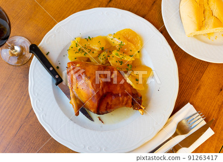 Popular dish of Spanish cuisine is Toston asado Popular dish of Spanish cuisine is Toston asado 91263417