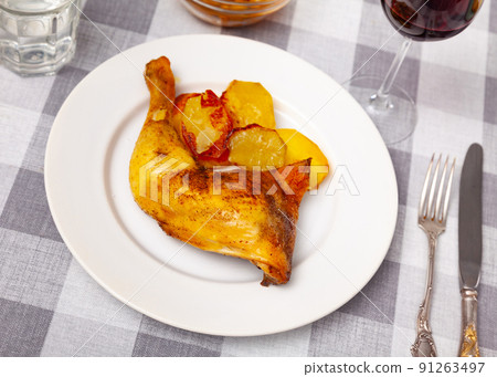 Just cooked chicken leg with fried potatoes 91263497