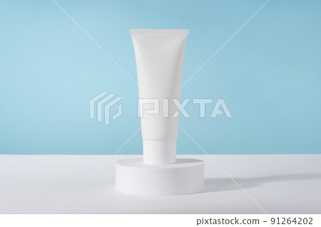 Cosmetic luxury cream tube bottle mockup on blue background on pedestal podium. Unbranded lotion beauty product packaging. Product presentation . Lotion, mousse, cleanser for skincare routine Cosmetic luxury cream tube bottle mockup on blue background on pedestal podium. Unbranded lotion beauty product packaging. Product presentation . Lotion, mousse, cleanser for skincare routine 91264202