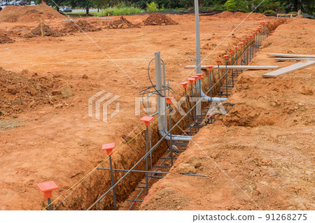Building a house foundation with steel in a trench Building a house foundation with steel in a trench 91268275