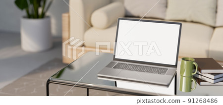 Portable notebook laptop on modern coffee table in modern comfortable living room. 91268486