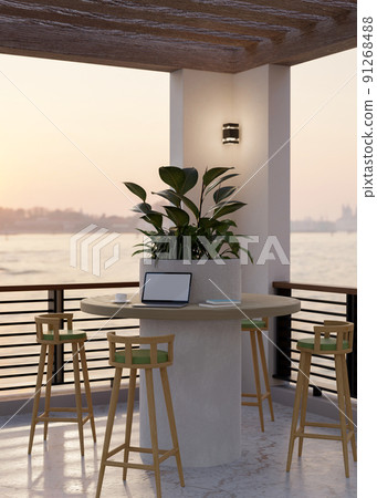 Portable laptop on a round table, stools, and decor plant in a hotel lounge relaxing area 91268488