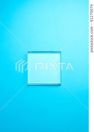 Empty glass podium on transparent clear blue water surface texture with ripples. Abstract nature background for product presentation. Flat lay cosmetic mockup, copy space Empty glass podium on transparent clear blue water surface texture with ripples. Abstract nature background for product presentation. Flat lay cosmetic mockup, copy space 91270074