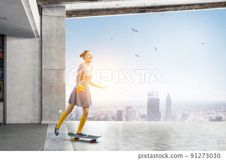 Beautiful young girl with skate board 91273030