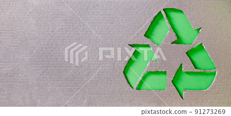 Recycling concept - recycling symbol made in cardboard with plastic, metal and glass in background Recycling concept - recycling symbol made in cardboard with plastic, metal and glass in background 91273269