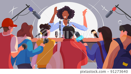 african american businesswoman or politician giving speech interview to journalists with microphones business conference 91273640
