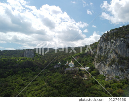 Christian church in the mountains above the sea. Temple of the Holy Archangel Michael in Oreanda. The southern coast of Crimea. Aerial view Christian church in the mountains above the sea. Temple of the Holy Archangel Michael in Oreanda. The southern coast of Crimea. Aerial view 91274668