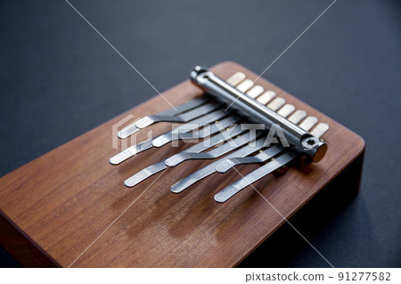 Traditional wooden kalimba isolated on black 91277582