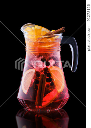 Pitcher with cold sangria isolated on black 91278126