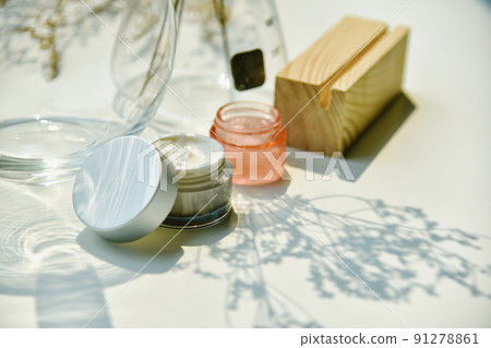 Cosmetic bottle container on sunlight and leaves plant shadow background, Skincare facial cream Cosmetic bottle container on sunlight and leaves plant shadow background, Skincare facial cream 91278861