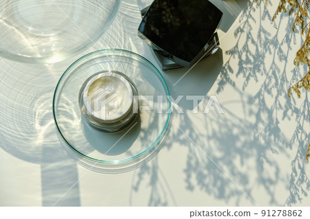 Cosmetic bottle container on sunlight and leaves plant shadow background, Skincare 91278862