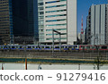 A medium-distance train that runs through the buildings of the big city of Tokyo 91279416