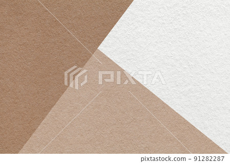 Texture of craft beige, brown and white shade color paper background, macro. Structure of vintage abstract cardboard Texture of craft beige, brown and white shade color paper background, macro. Structure of vintage abstract cardboard 91282287