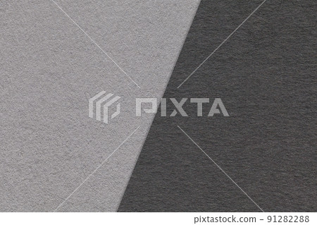 Texture of craft gray and black paper background, half two colors, macro. Structure of vintage craft grey cardboard. Texture of craft gray and black paper background, half two colors, macro. Structure of vintage craft grey cardboard. 91282288