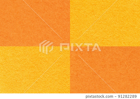 Texture of craft bright orange and yellow paper background with cells pattern, macro. Structure of vintage cardboard. Texture of craft bright orange and yellow paper background with cells pattern, macro. Structure of vintage cardboard. 91282289