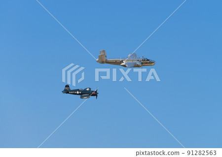 B-25J F4U-4 Corsair carrier-capable fighter escorting Mitchell bomber B-25J F4U-4 Corsair carrier-capable fighter escorting Mitchell bomber 91282563