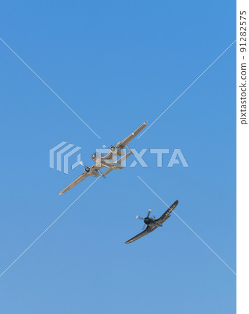 B-25J F4U-4 Corsair carrier-capable fighter escorting Mitchell bomber 91282575