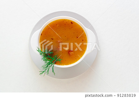 Pea soup with bacon and dill in a bowl on a white isolated. Selective focus. great design for the menu of your restaurant, cafe or design. Horizontal photo. 91283819