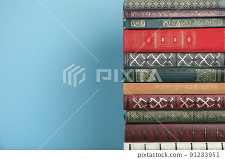 Stack of hardcover books on light blue background, space for text Stack of hardcover books on light blue background, space for text 91283951