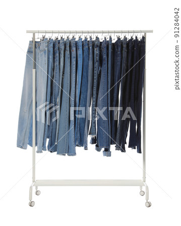 Rack with different jeans isolated on white Rack with different jeans isolated on white 91284042