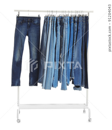 Rack with different jeans isolated on white Rack with different jeans isolated on white 91284043