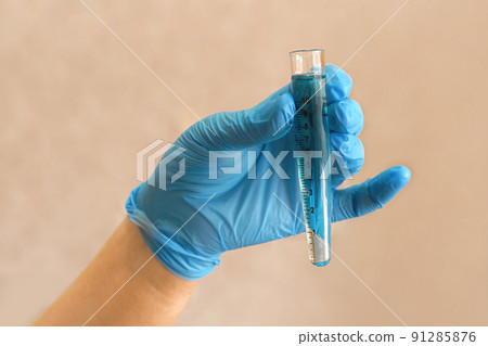 Hand of scientist in blue gloves with test tube on beige background. Medical laboratory testing, analysis and research. Chemistry, science, biology experiment technology, pharmacy. Banner Hand of scientist in blue gloves with test tube on beige background. Medical laboratory testing, analysis and research. Chemistry, science, biology experiment technology, pharmacy. Banner 91285876