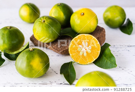 Mapo fruits on the white wooden table and stone stand Mapo fruits on the white wooden table and stone stand 91288725