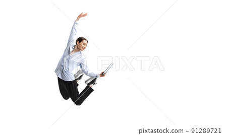 Portrait of young woman, office worker posing with notes in a jump isolated over white studio background 91289721