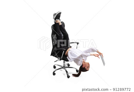 Business woman lying on chair with legs up, working on tablet isolated over white studio background. Business woman lying on chair with legs up, working on tablet isolated over white studio background. 91289772