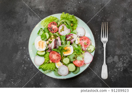 Fresh salad with vegetables and eggs for proper nutrition. Summer food. Top view, copy space. Proper nutrition. Diet for weight loss concept. Fresh salad with vegetables and eggs for proper nutrition. Summer food. Top view, copy space. Proper nutrition. Diet for weight loss concept. 91289923