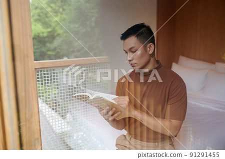 Man Reading Book of Stories Man Reading Book of Stories 91291455