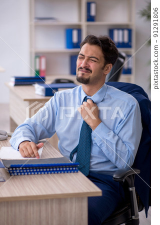 Young male employee working in the office Young male employee working in the office 91291806